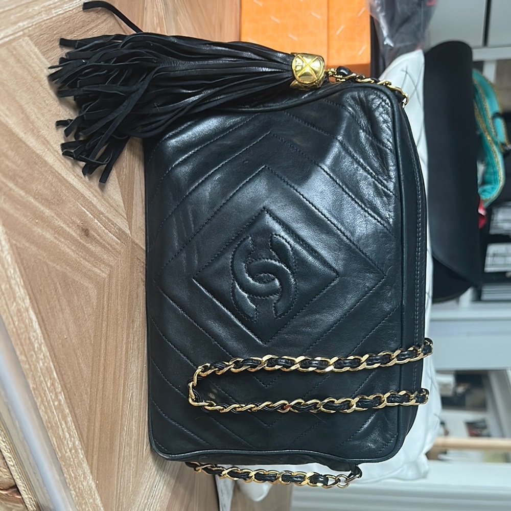 Chanel vintage Camera bag. Chic Black Leather Bag with Gold Chain.